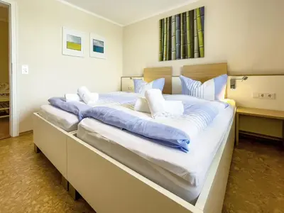 Ein Bett oder Betten in einem Zimmer der Unterkunft Haus Horizont I HZ21