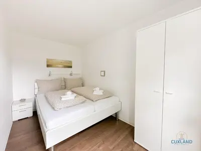 Ein Bett oder Betten in einem Zimmer der Unterkunft Haus Pavillon Wohnung 5