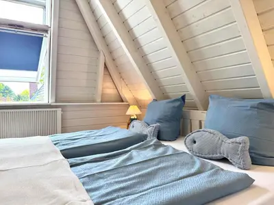 Ein Bett oder Betten in einem Zimmer der Unterkunft Dat Onnens Hus