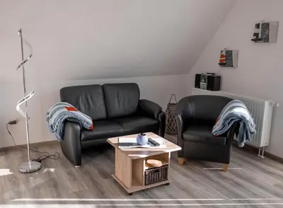 Ein Sitzbereich in der Unterkunft Noch ´ne Brise Wohnung 1 Trischen