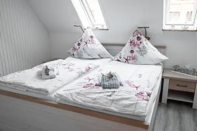 Ein Bett oder Betten in einem Zimmer der Unterkunft Noch ´ne Brise Wohnung 1 Trischen
