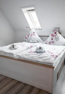 Ein Bett oder Betten in einem Zimmer der Unterkunft Noch ´ne Brise Wohnung 1 Trischen