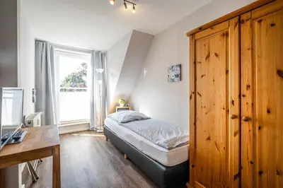 Ein Bett oder Betten in einem Zimmer der Unterkunft Haus Regenpfeifer Wohnung 4