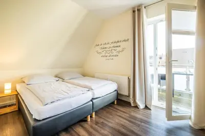 Ein Bett oder Betten in einem Zimmer der Unterkunft Haus Regenpfeifer Wohnung 3