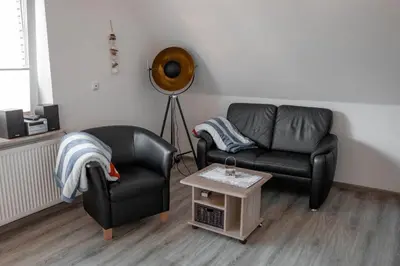 Ein Sitzbereich in der Unterkunft Noch ´ne Brise Wohnung 3 Blauort