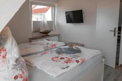 Ein Bett oder Betten in einem Zimmer der Unterkunft Noch ´ne Brise Wohnung 3 Blauort