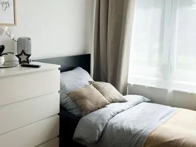 Ein Bett oder Betten in einem Zimmer der Unterkunft Brunsbüttel City Apartments