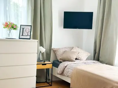 Ein Bett oder Betten in einem Zimmer der Unterkunft Brunsbüttel City Apartments