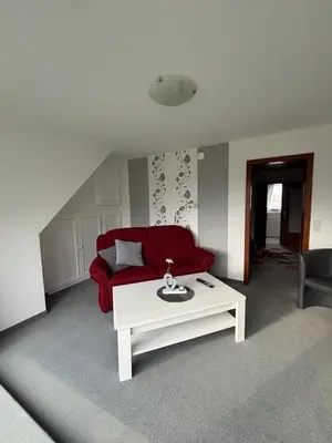 Ein Sitzbereich in der Unterkunft Ferienwohnung Gezeiten
