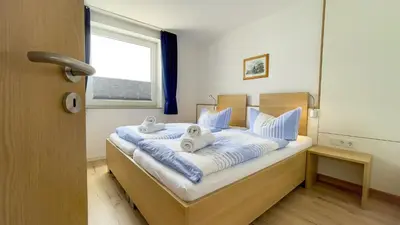 Ein Bett oder Betten in einem Zimmer der Unterkunft Haus Horizont I HZ04