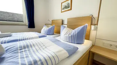 Ein Bett oder Betten in einem Zimmer der Unterkunft Haus Horizont I HZ04