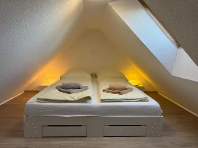 Ein Bett oder Betten in einem Zimmer der Unterkunft Ferienwohnung Altenwalde