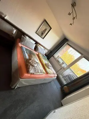 Ein Bett oder Betten in einem Zimmer der Unterkunft Penthouse Cuxhaven-Döse