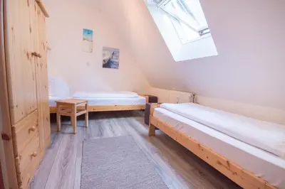 Ein Bett oder Betten in einem Zimmer der Unterkunft Hamburger Str 24 FeWo Möwe 4