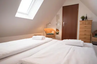 Ein Bett oder Betten in einem Zimmer der Unterkunft Hamburger Str 24 FeWo Möwe 4