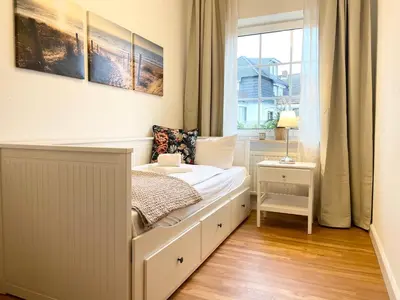Ein Bett oder Betten in einem Zimmer der Unterkunft Muscheleck FeWo 2