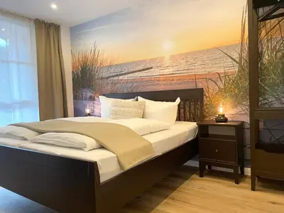 Ein Bett oder Betten in einem Zimmer der Unterkunft Haus Nordseebrandung FeWo 4