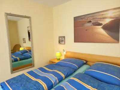Ein Bett oder Betten in einem Zimmer der Unterkunft BUE - Friesenwinkel