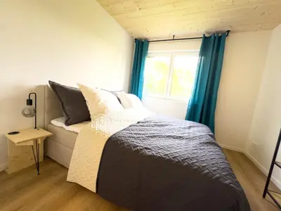 Ein Bett oder Betten in einem Zimmer der Unterkunft LieblingsKOOG