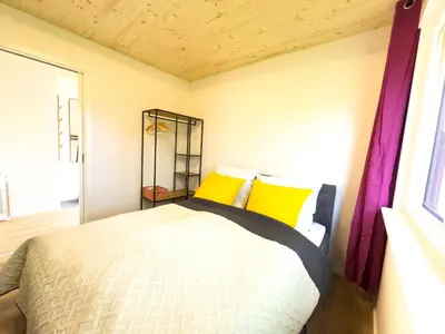 Ein Bett oder Betten in einem Zimmer der Unterkunft LieblingsKOOG