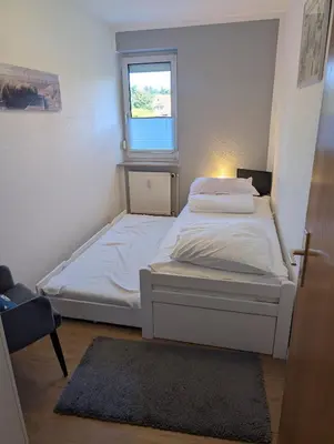 Ein Bett oder Betten in einem Zimmer der Unterkunft Nige Ooge FeWo 9