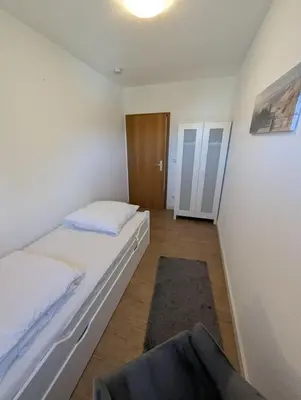 Ein Bett oder Betten in einem Zimmer der Unterkunft Nige Ooge FeWo 9