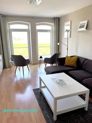 Ein Sitzbereich in der Unterkunft Haus Seewind, App 06