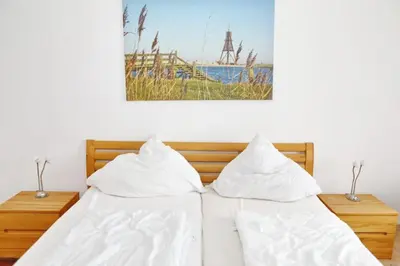 Ein Bett oder Betten in einem Zimmer der Unterkunft Haus Nordseeblick, App 04
