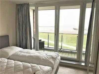 Ein Bett oder Betten in einem Zimmer der Unterkunft Haus Nordseeblick, App 13
