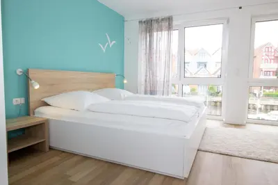 Ein Bett oder Betten in einem Zimmer der Unterkunft Marina 24-A