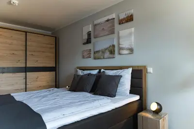 Ein Bett oder Betten in einem Zimmer der Unterkunft Hummerklippe 1