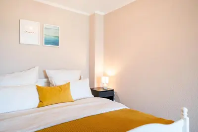 Ein Bett oder Betten in einem Zimmer der Unterkunft Küstenjunge 