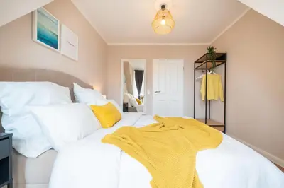 Ein Bett oder Betten in einem Zimmer der Unterkunft Küstenjunge 