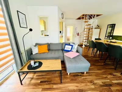 Ein Sitzbereich in der Unterkunft Lüttje Deichvilla XL