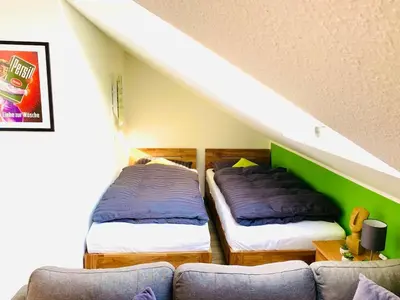 Ein Bett oder Betten in einem Zimmer der Unterkunft Lüttje Deichvilla XL