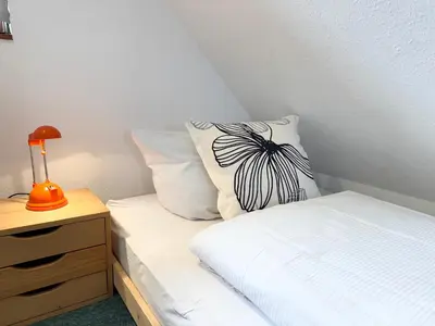 Ein Bett oder Betten in einem Zimmer der Unterkunft Haus Muschelnest