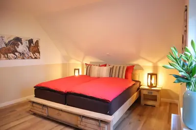 Ein Bett oder Betten in einem Zimmer der Unterkunft Landhuus an´n Peerhamm