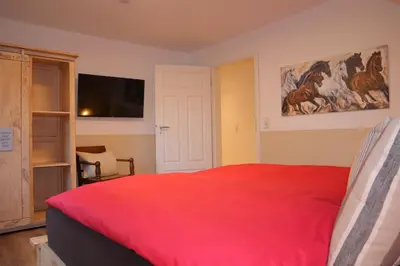 Ein Bett oder Betten in einem Zimmer der Unterkunft Landhuus an´n Peerhamm