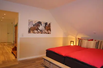 Ein Bett oder Betten in einem Zimmer der Unterkunft Landhuus an´n Peerhamm