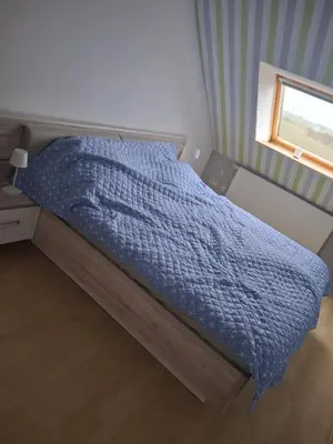 Ein Bett oder Betten in einem Zimmer der Unterkunft Schöne Doppelhaushälfte am Meer!