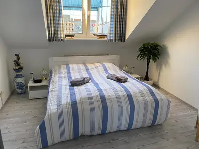 Ein Bett oder Betten in einem Zimmer der Unterkunft Ferienwohnung Meeresidyll
