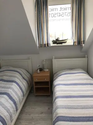 Ein Bett oder Betten in einem Zimmer der Unterkunft Ferienwohnung Meeresidyll