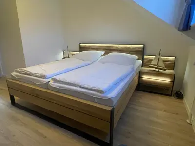 Ein Bett oder Betten in einem Zimmer der Unterkunft Ferienwohnung Watt'n Idyll