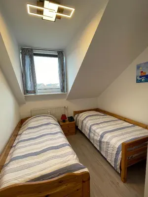 Ein Bett oder Betten in einem Zimmer der Unterkunft Ferienwohnung Watt'n Idyll