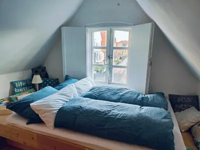 Ein Bett oder Betten in einem Zimmer der Unterkunft Schleusenwärterhaus am Ostedeich