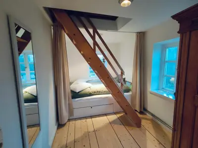 Ein Bett oder Betten in einem Zimmer der Unterkunft Schleusenwärterhaus am Ostedeich