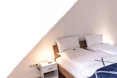 Ein Bett oder Betten in einem Zimmer der Unterkunft Altstadthotel Eibsen