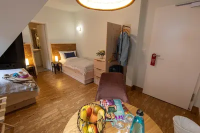 Ein Bett oder Betten in einem Zimmer der Unterkunft Altstadthotel Eibsen