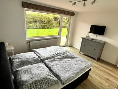 Ein Bett oder Betten in einem Zimmer der Unterkunft Ferienwohnungen am Wattenmeer