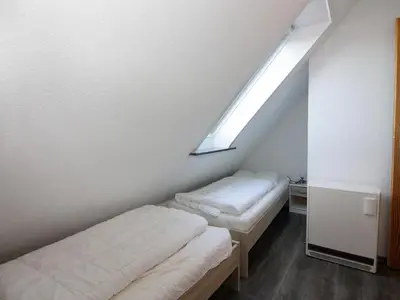 Ein Bett oder Betten in einem Zimmer der Unterkunft Ferienwohnung im Reihenhaus, Friedrichskoog-Spitze